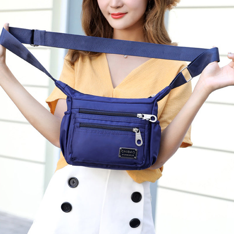 Crossbody-veske i flerlags nylon for kvinner