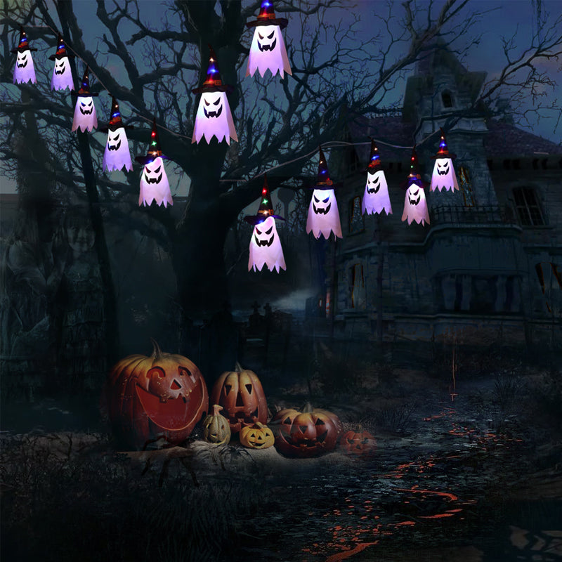 Opphengt, lysende og glødende heksehatt til halloween