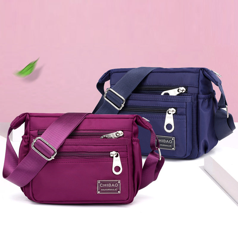 Crossbody-veske i flerlags nylon for kvinner