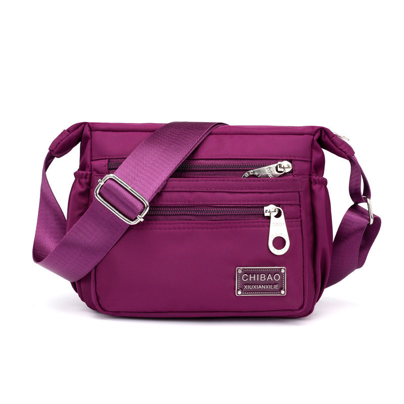 Crossbody-veske i flerlags nylon for kvinner
