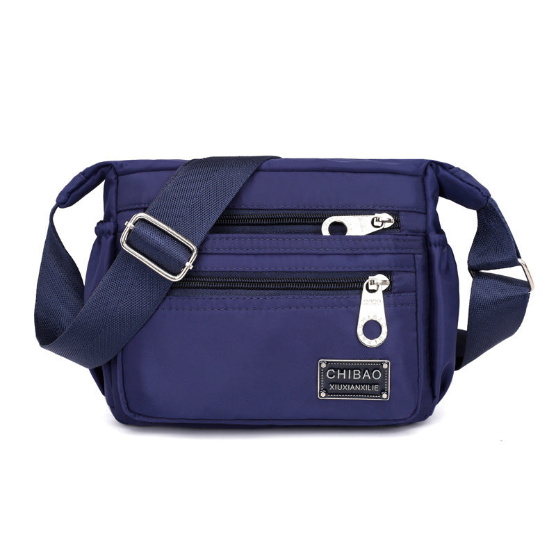 Crossbody-veske i flerlags nylon for kvinner