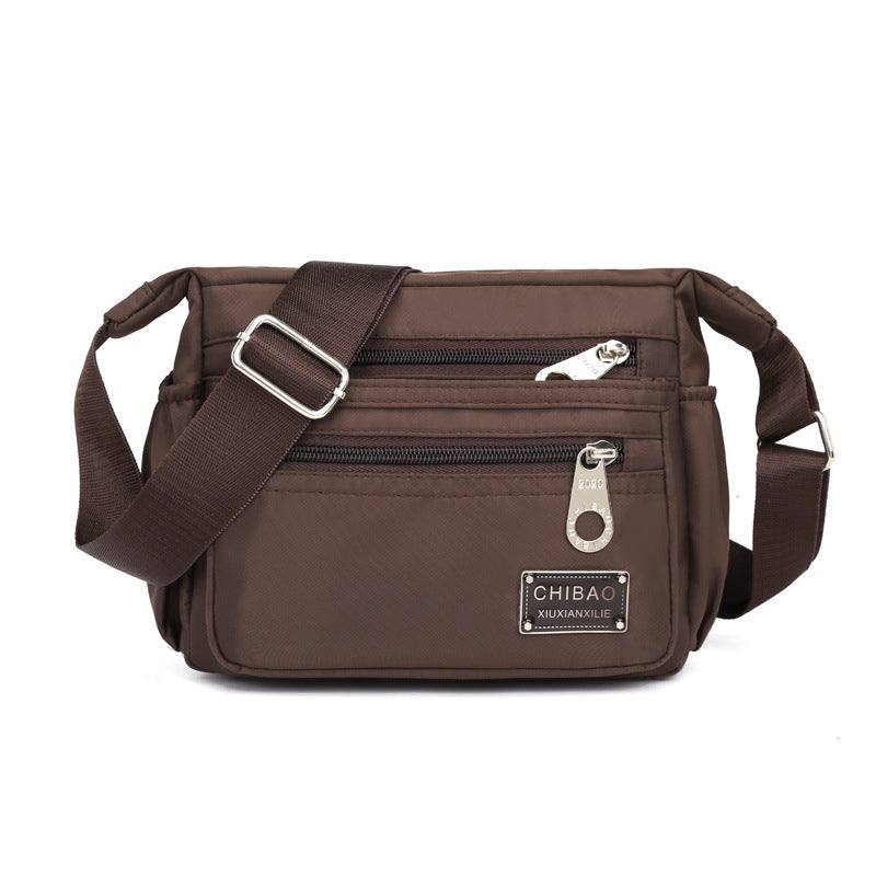 Crossbody-veske i flerlags nylon for kvinner